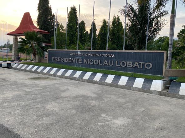 A photo of the sign of the Dili Airport