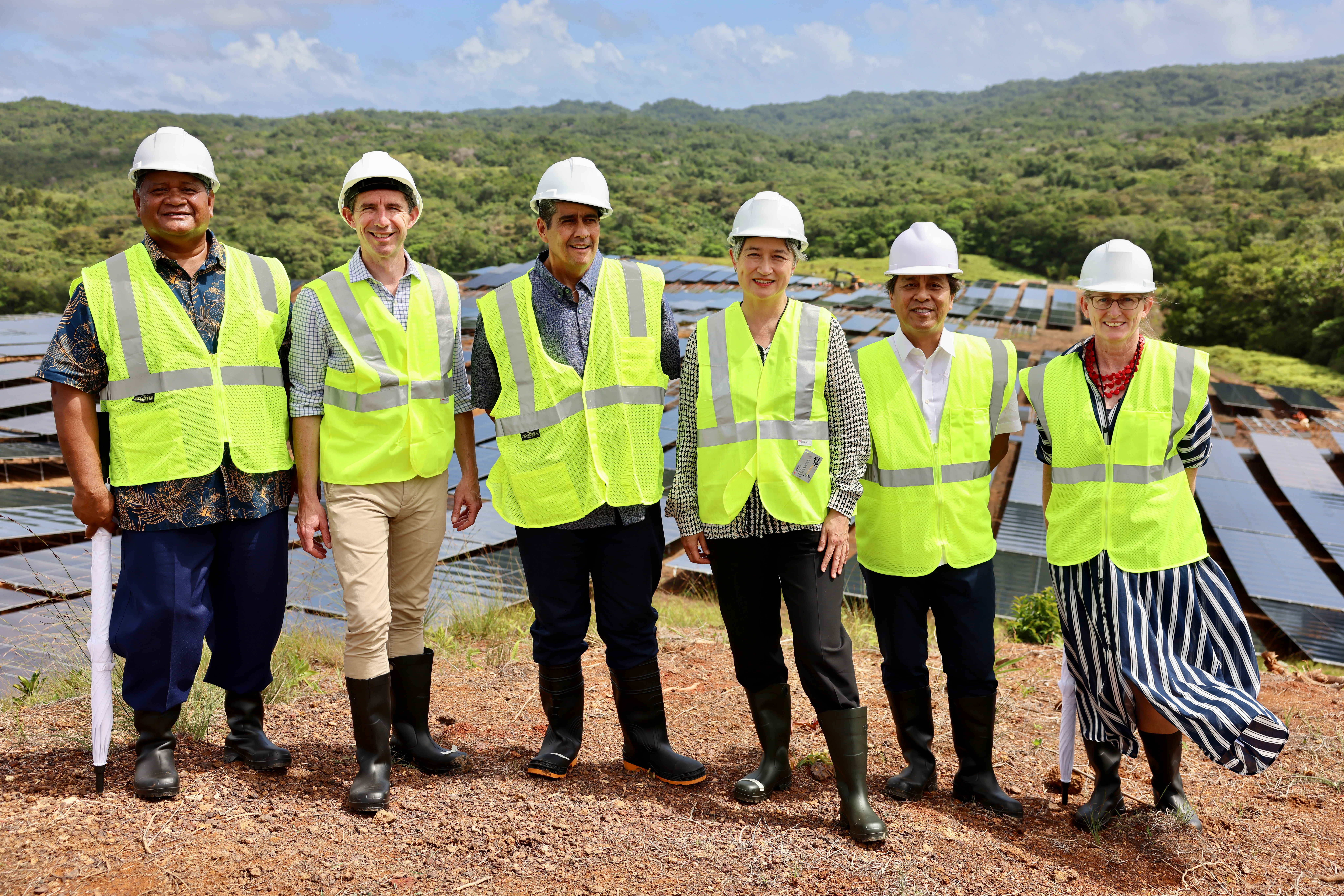 Minister for Foreign Affairs Senator the Hon Penny Wong (fourth from left) and Australia’s Ambassador to Palau Richelle Turner (far right) visit the project site at Ngatpang with stakeholders, December 2023