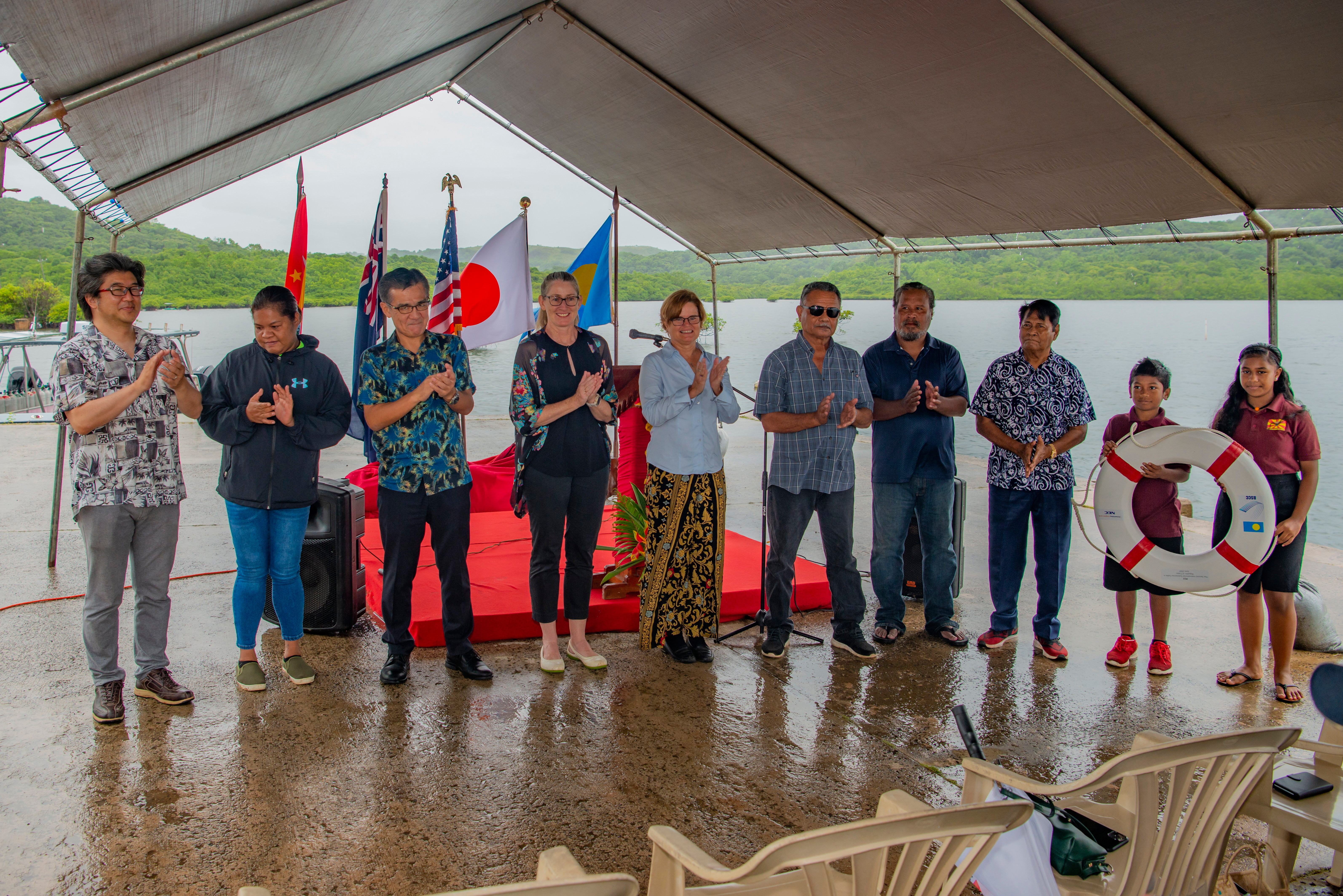Project stakeholders including Australia’s Ambassador to Palau Richelle Turner (fourth from left) at the project’s cable laying in Palau, June 2022.